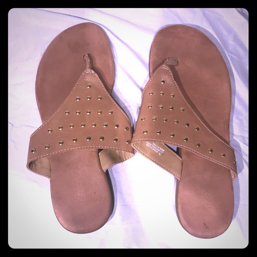 Tan and gold flip flop sandals